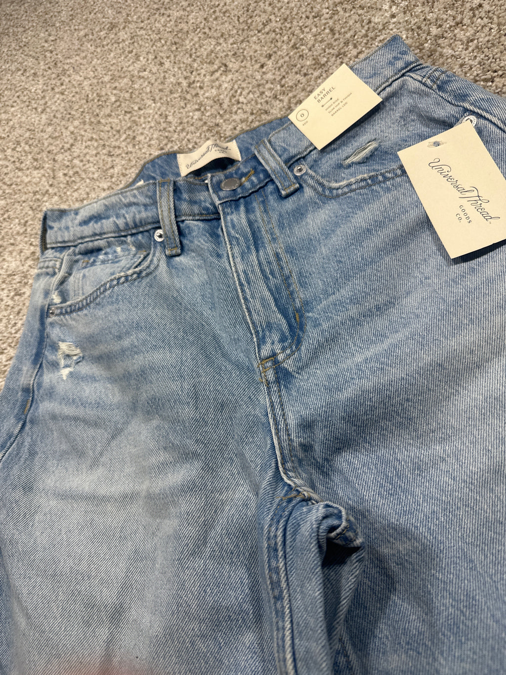 Universal Thread size 0 high-rise easy barrel jeans waistband and retail tag