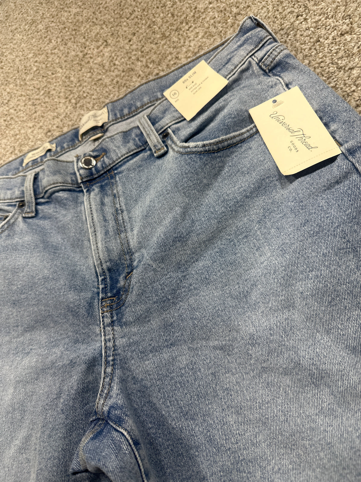 Universal Thread size 16 regular medium wash 90s slim jeans waistband and retail tag