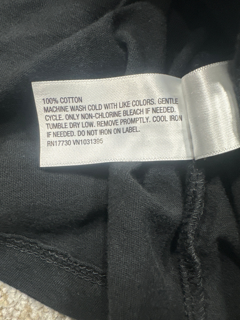 Universal Thread T-shirt material label showing 100 percent cotton