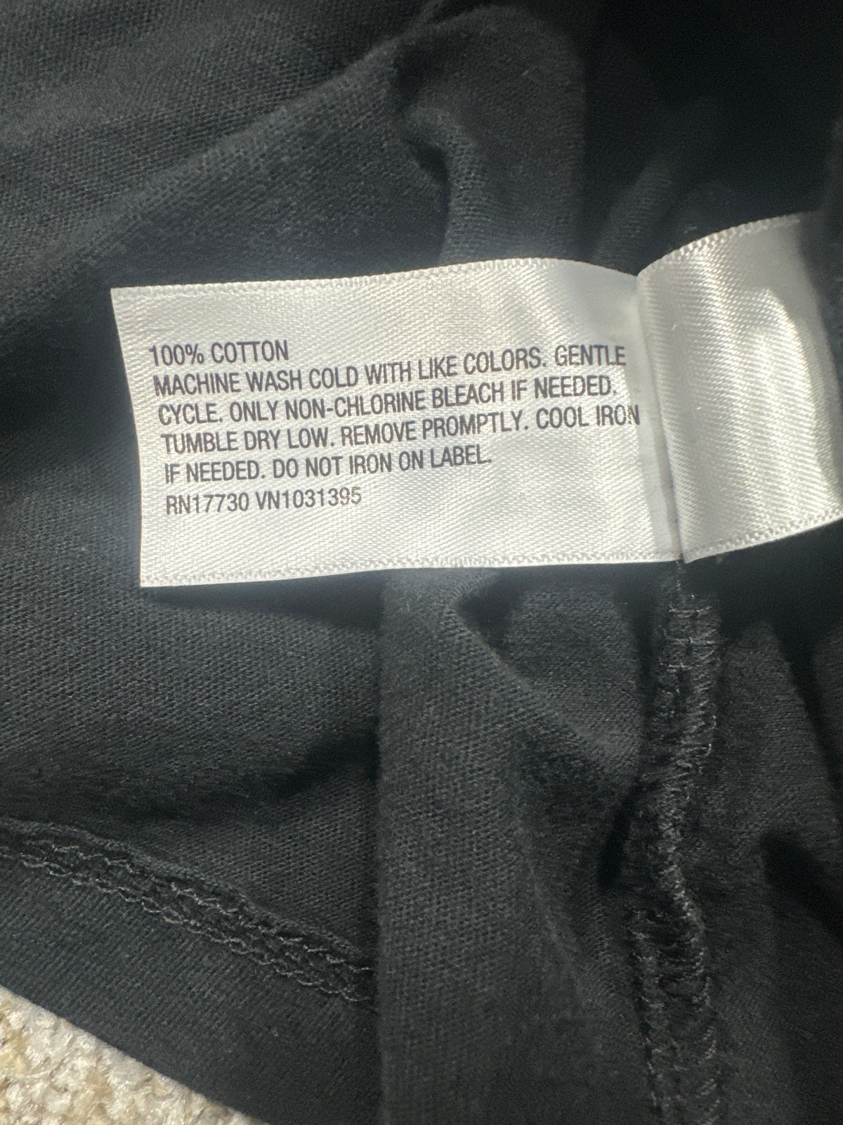 Universal Thread T-shirt material label showing 100 percent cotton