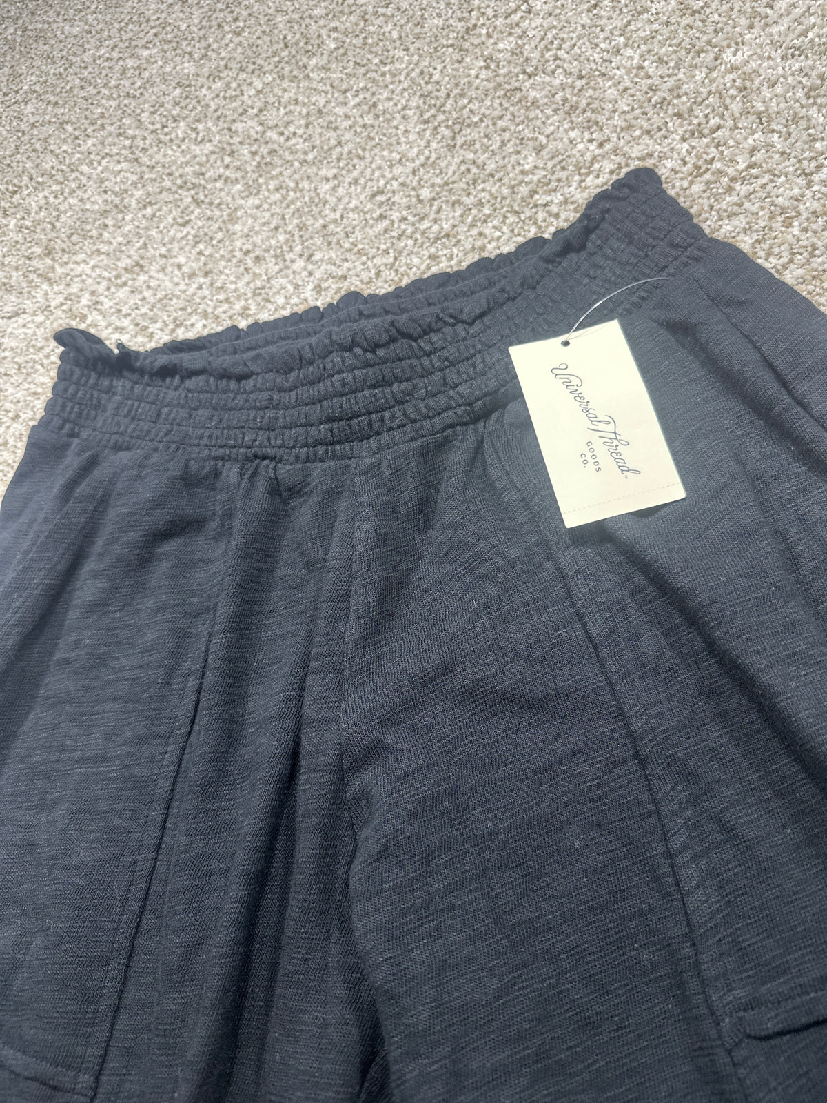 Universal Thread black pants waistband and front pockets detail