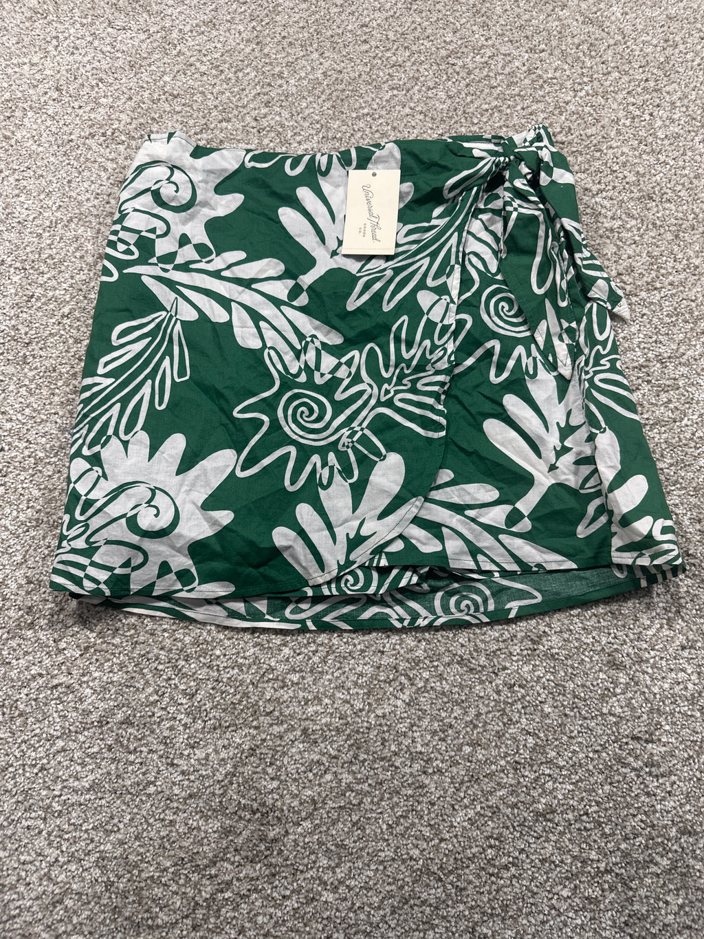 Universal Thread women’s green and white printed wrap skirt front view