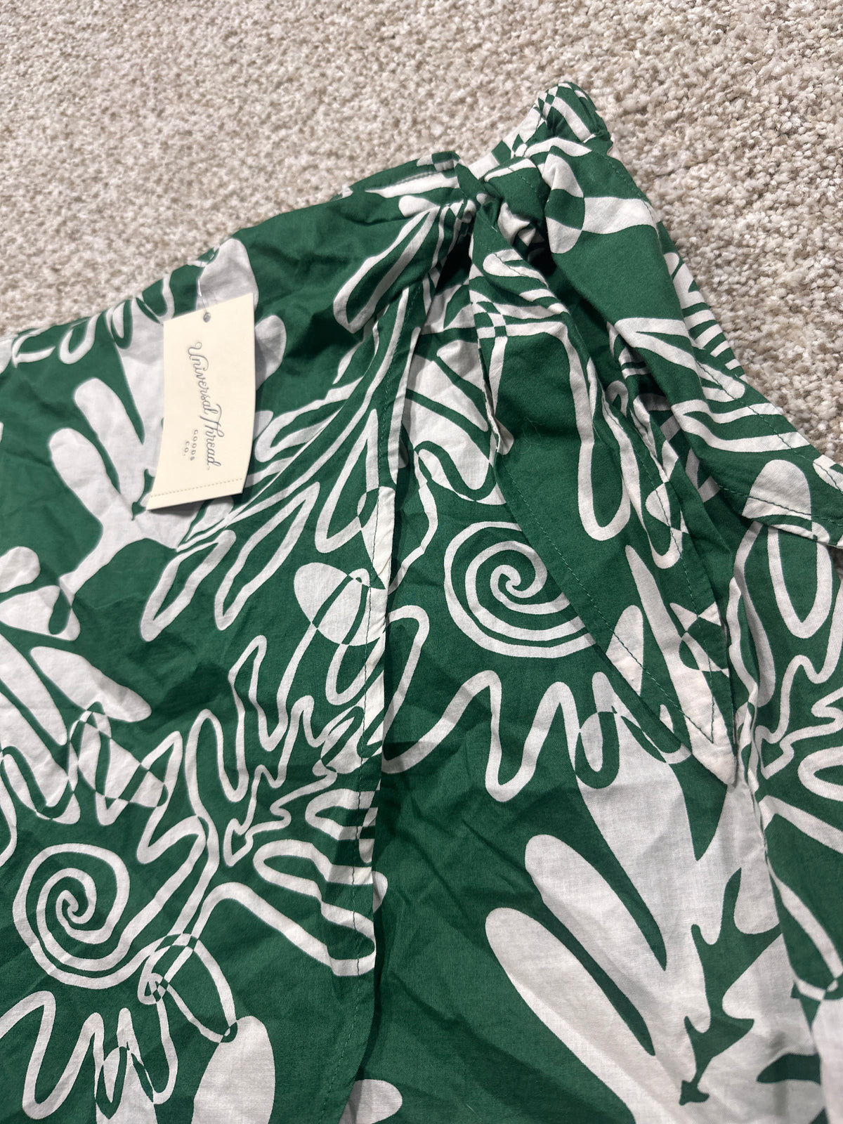 Universal Thread green and white skirt waist tie detail