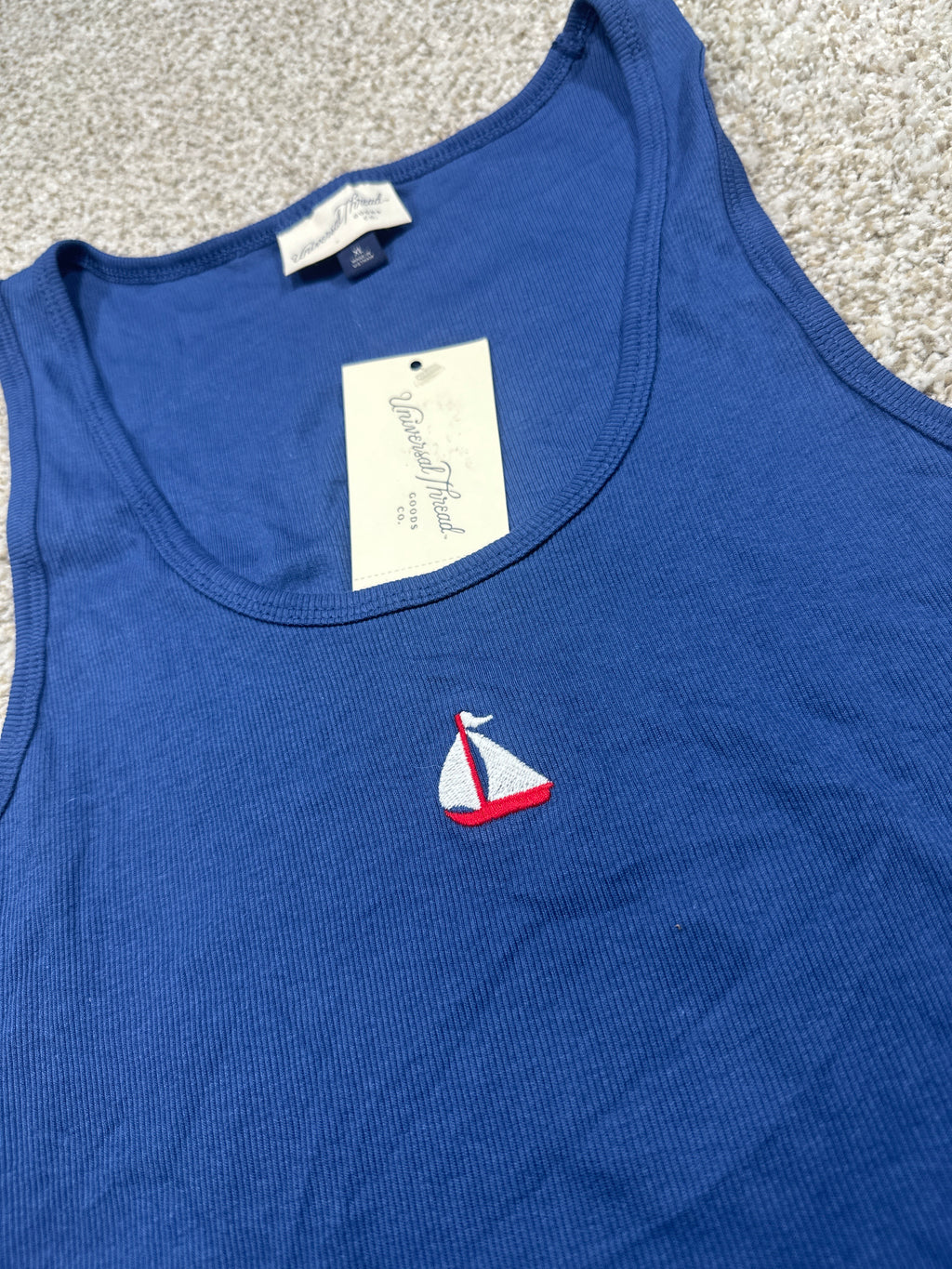 Universal Thread navy tank top neckline and embroidered sailboat detail