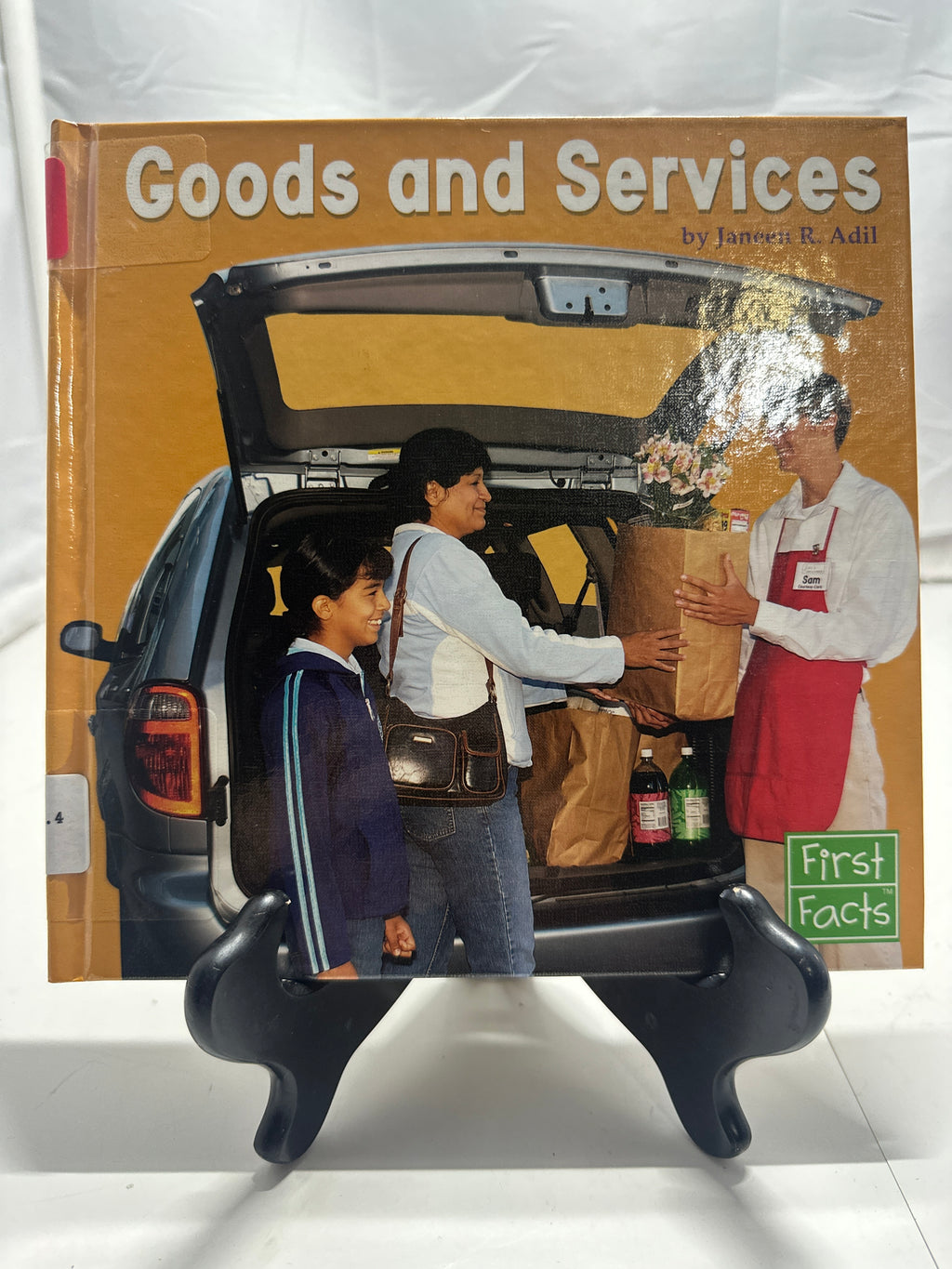 Goods and Services by Janeen R. Adil Hardcover