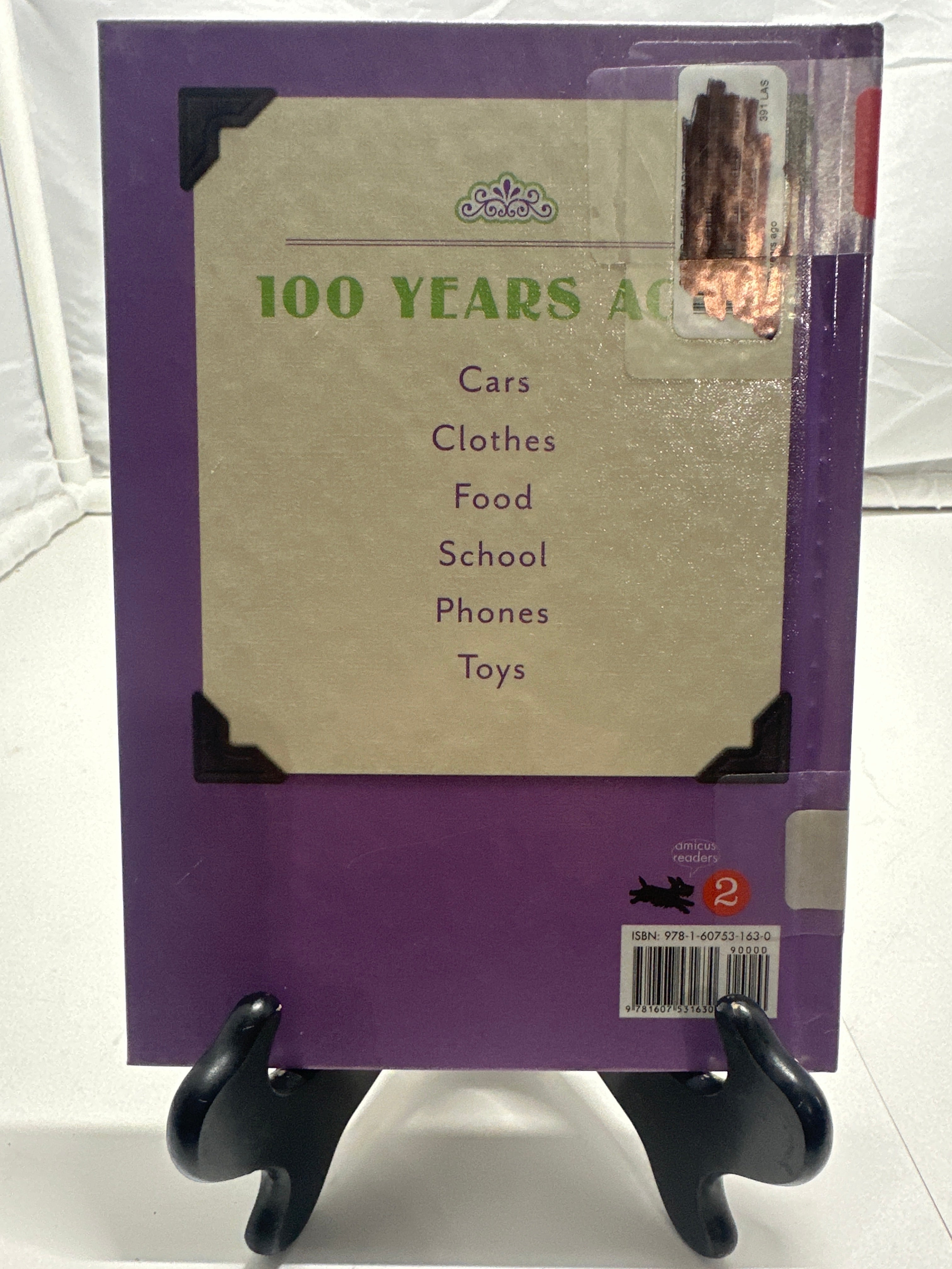 Clothes 100 years ago by Allison Lassieur Hardcover Children