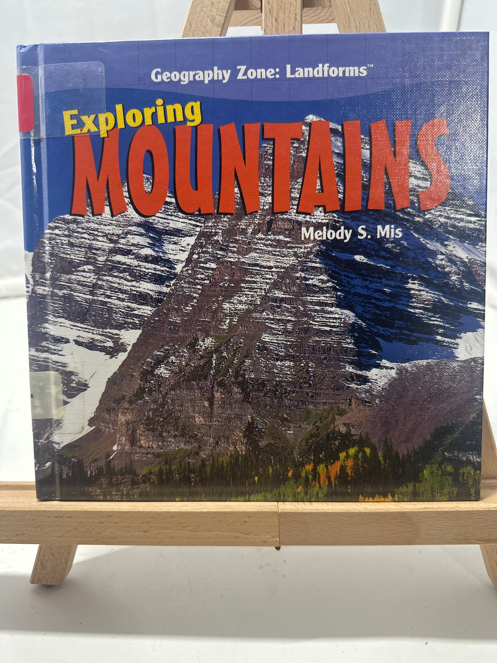 Exploring mountains by Melody S. Mis Hardcover Children's Book