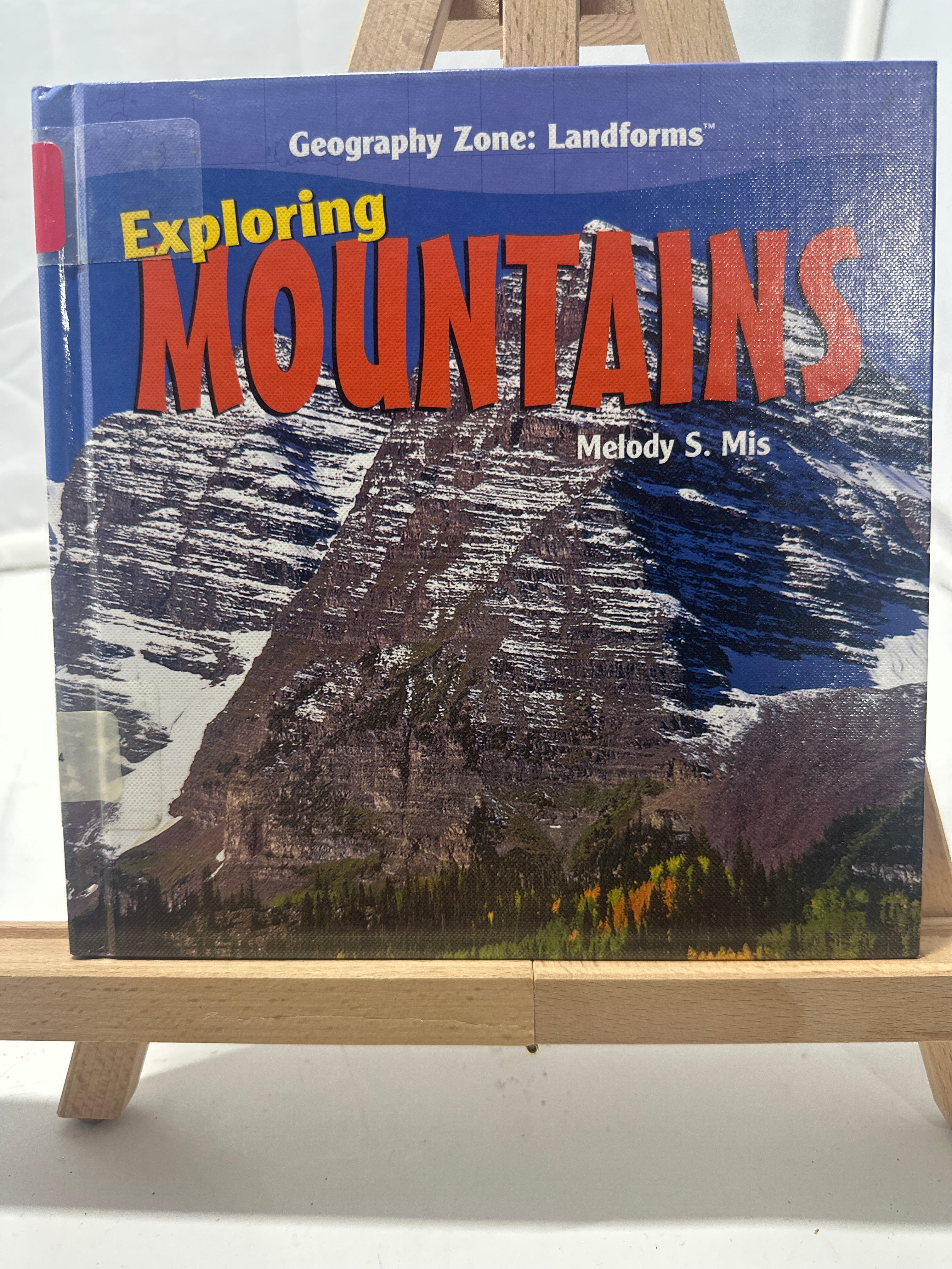 Exploring mountains by Melody S. Mis Hardcover Children's Book