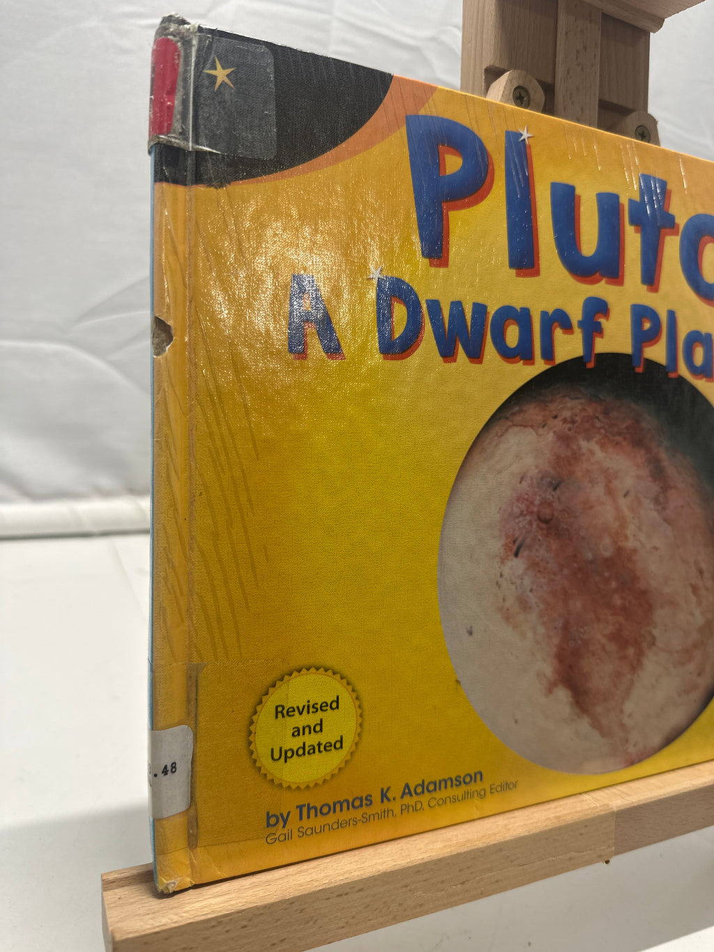 Pluto by Thomas K. Adamson Hardcover