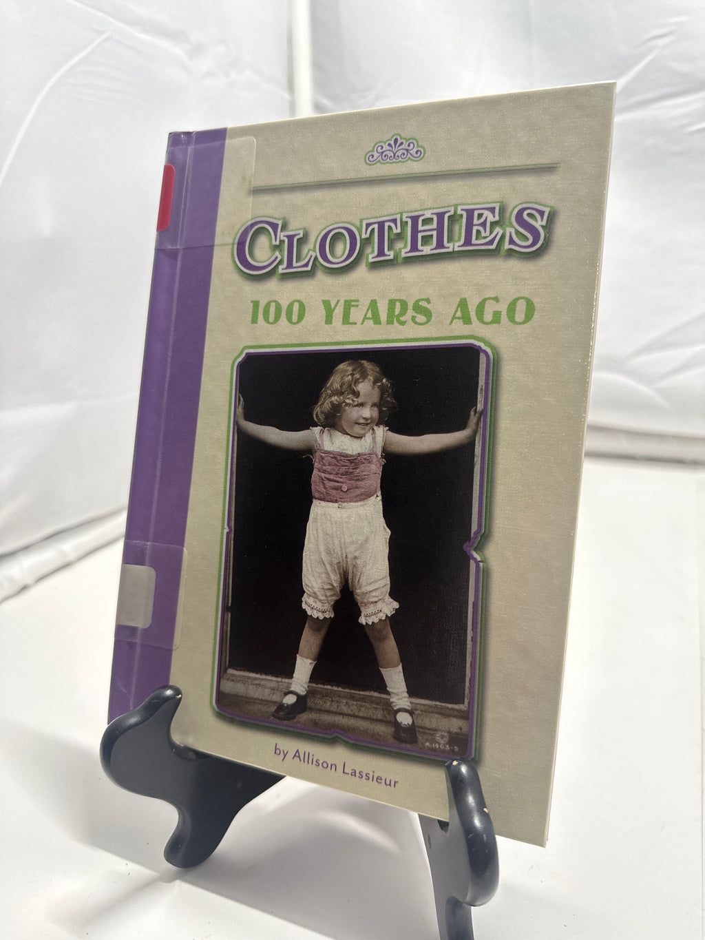 Clothes 100 years ago by Allison Lassieur Hardcover Children