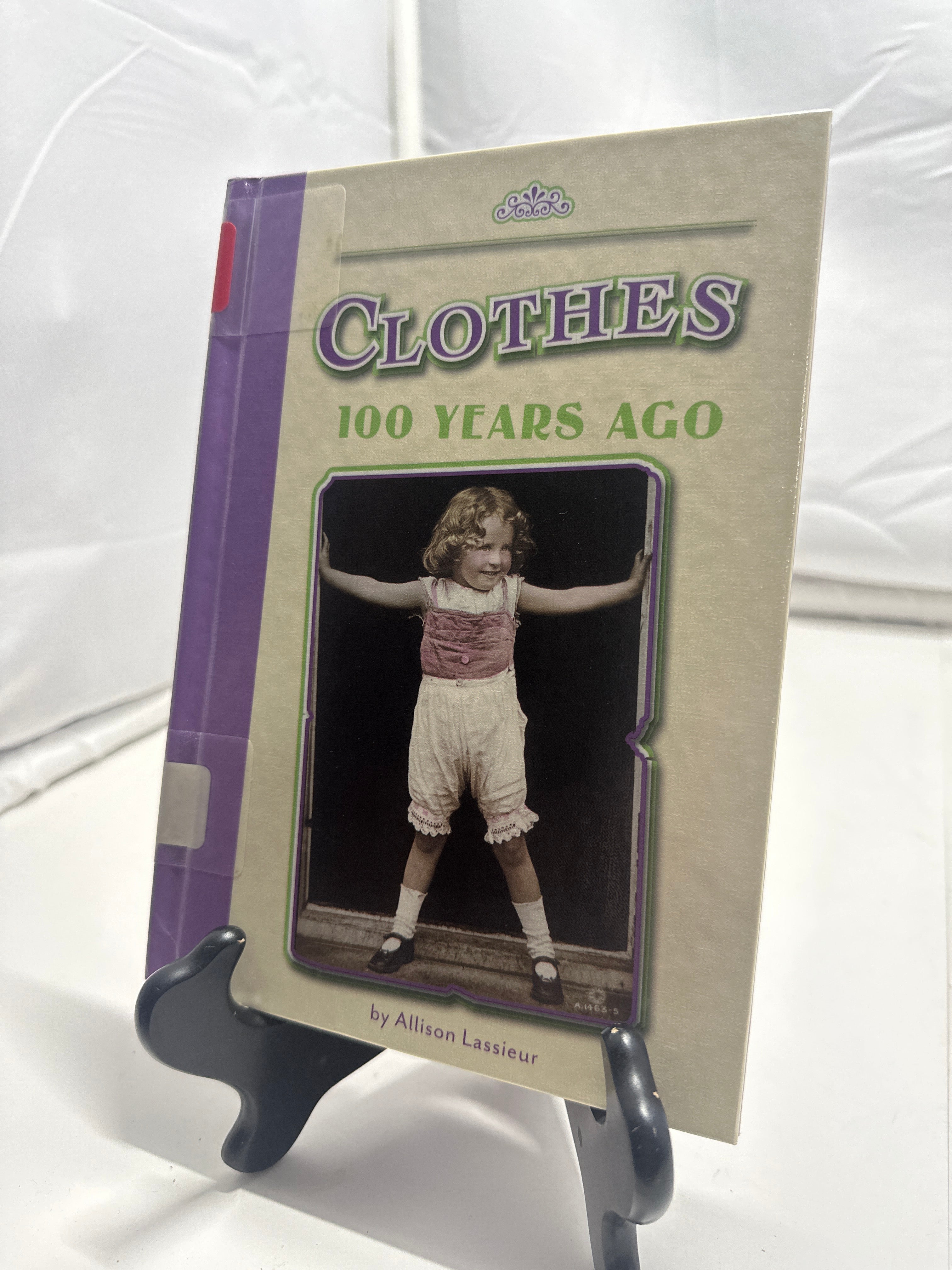 Clothes 100 years ago by Allison Lassieur Hardcover Children