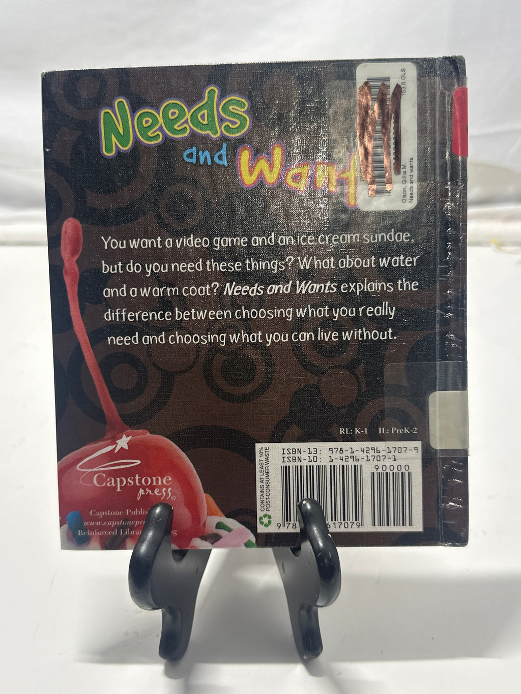Needs and wants by Gillia M. Olson Hardcover Children's Book