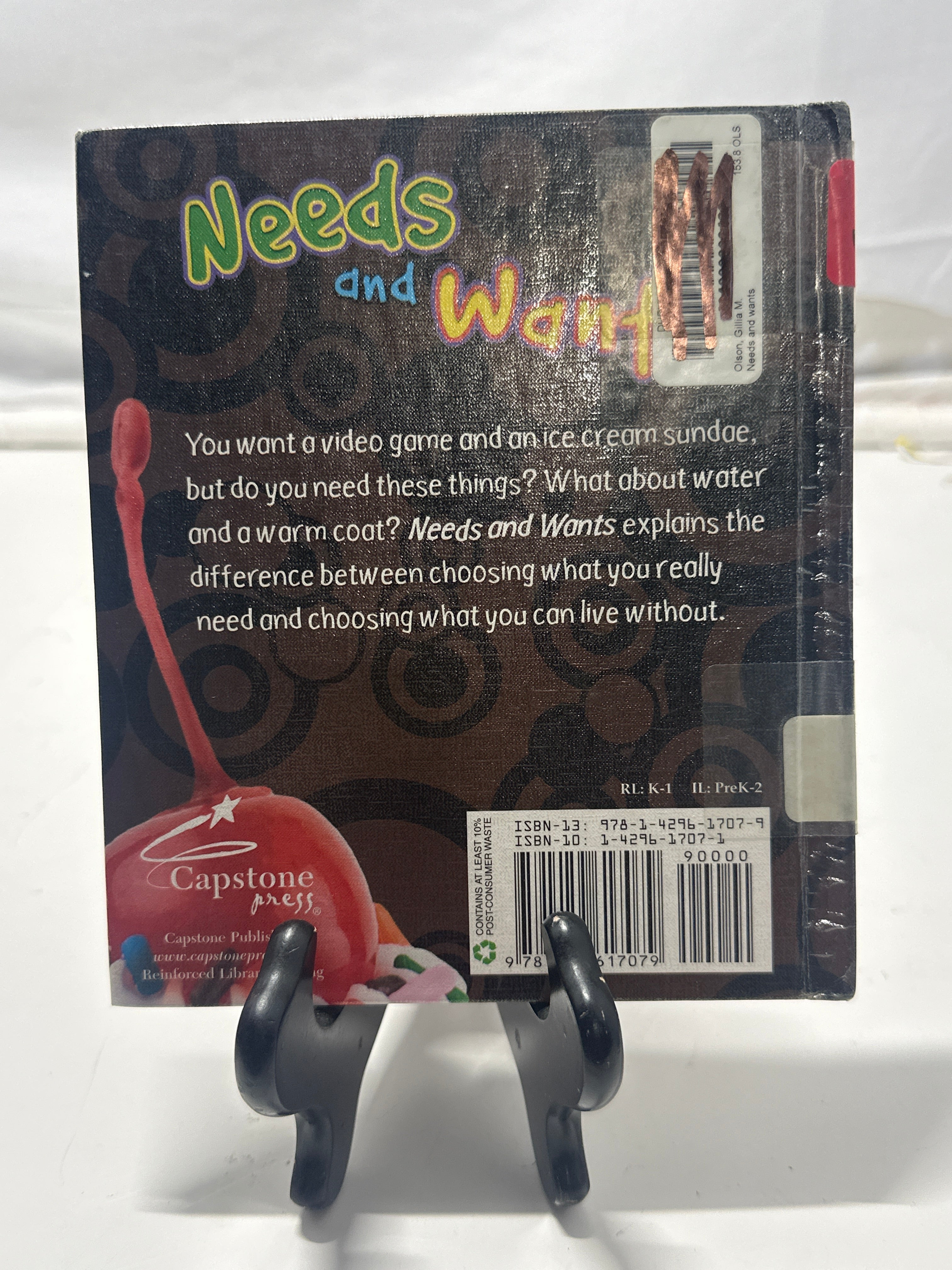 Needs and wants by Gillia M. Olson Hardcover Children's Book
