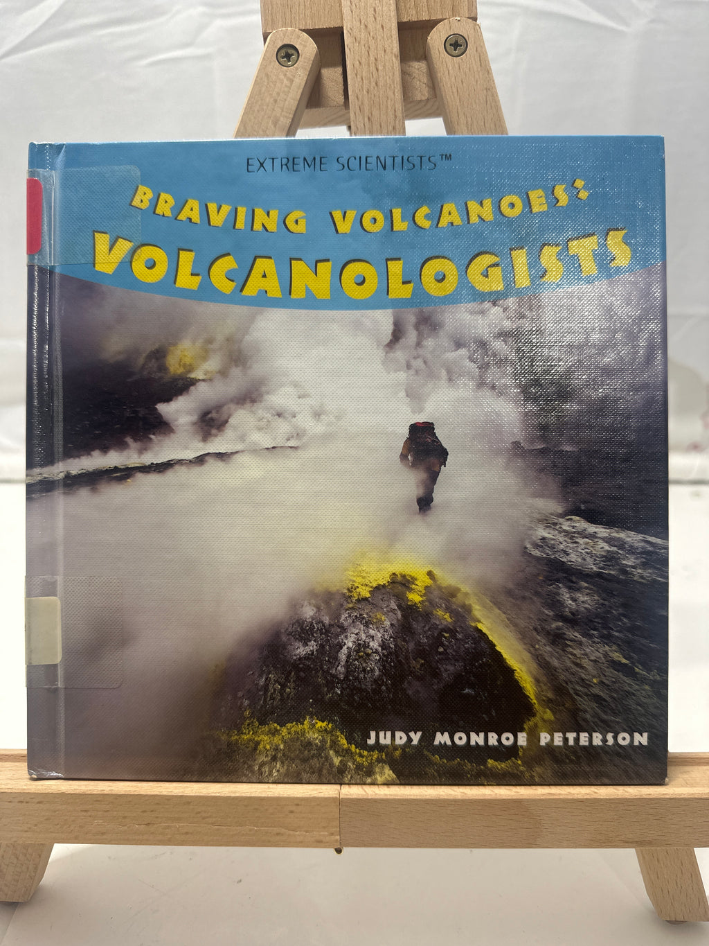 Braving volcanoes by Judy Monroe Peterson Hardcover Children's Book