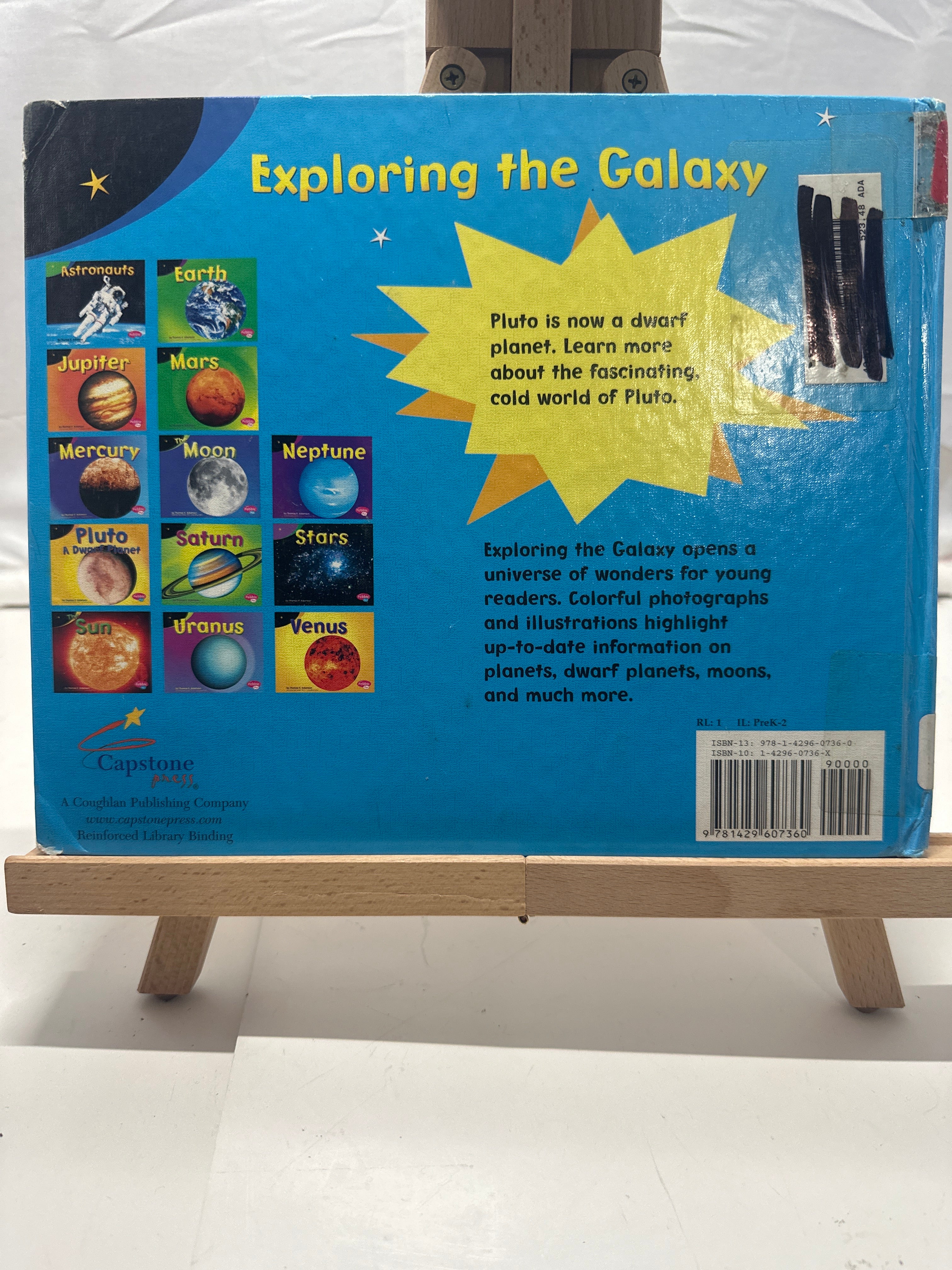 Pluto by Thomas K. Adamson Hardcover