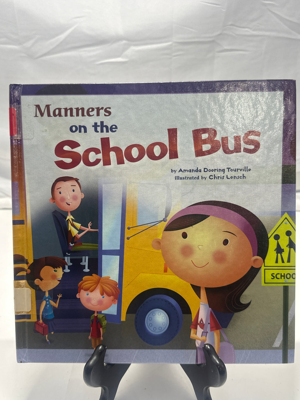 Manners on the school bus by Amanda Doering Tourville Hardcover Children's Book