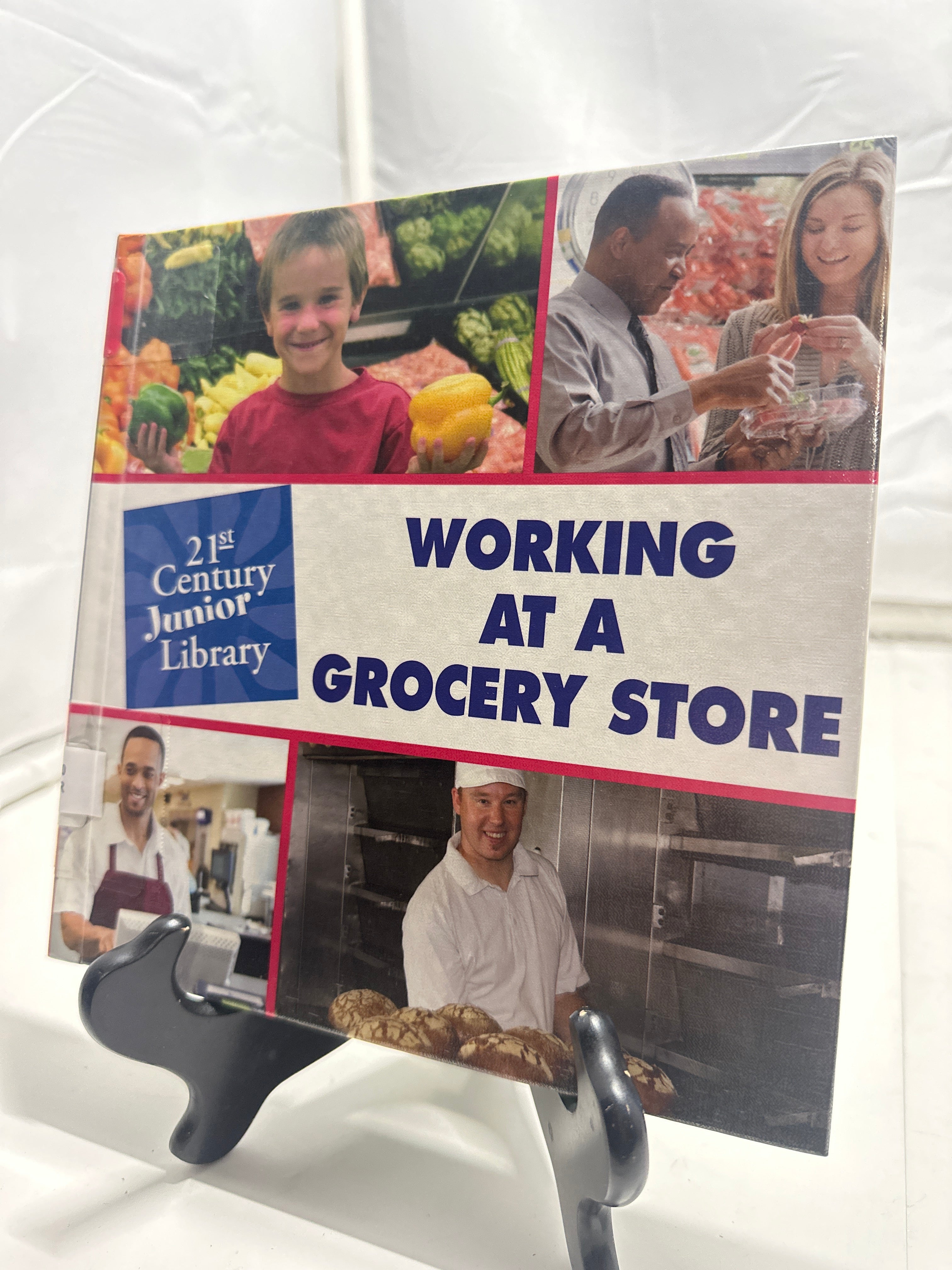 Working in a grocery store by Katie Marsico Hardcover Children's Book