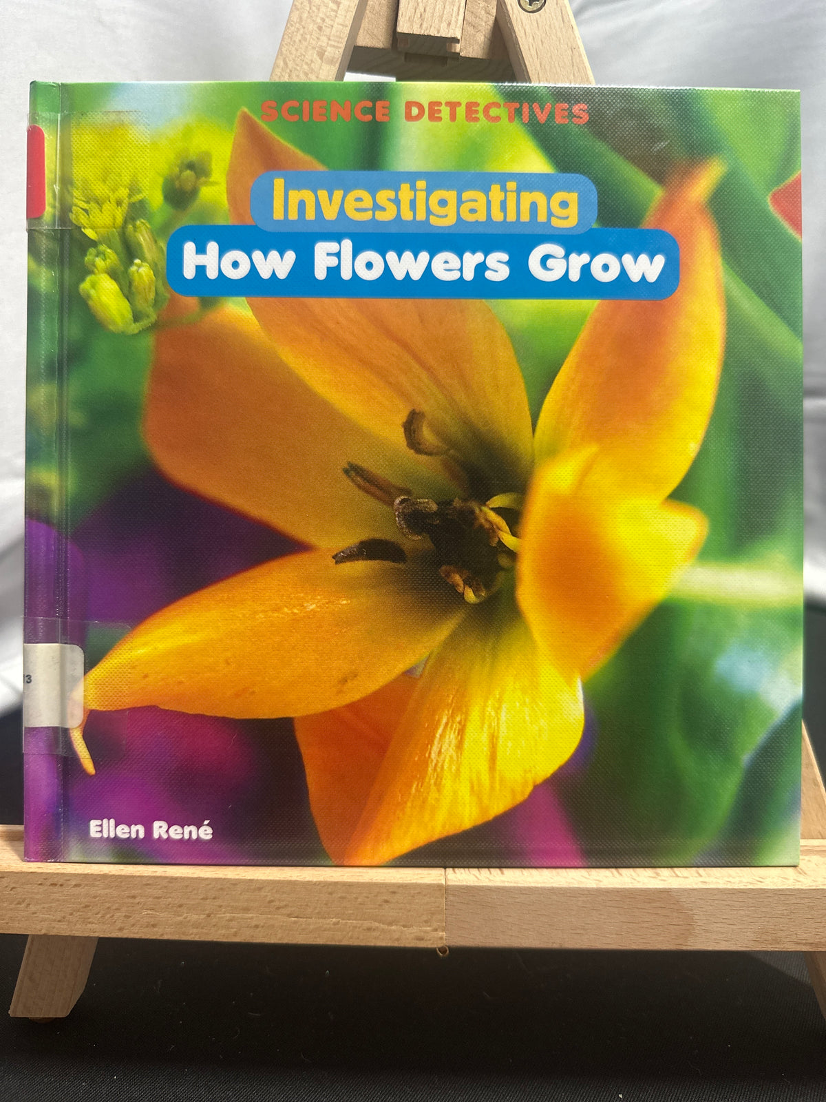 Investigating how flowers grow by Ellen René Hardcover Children's Book