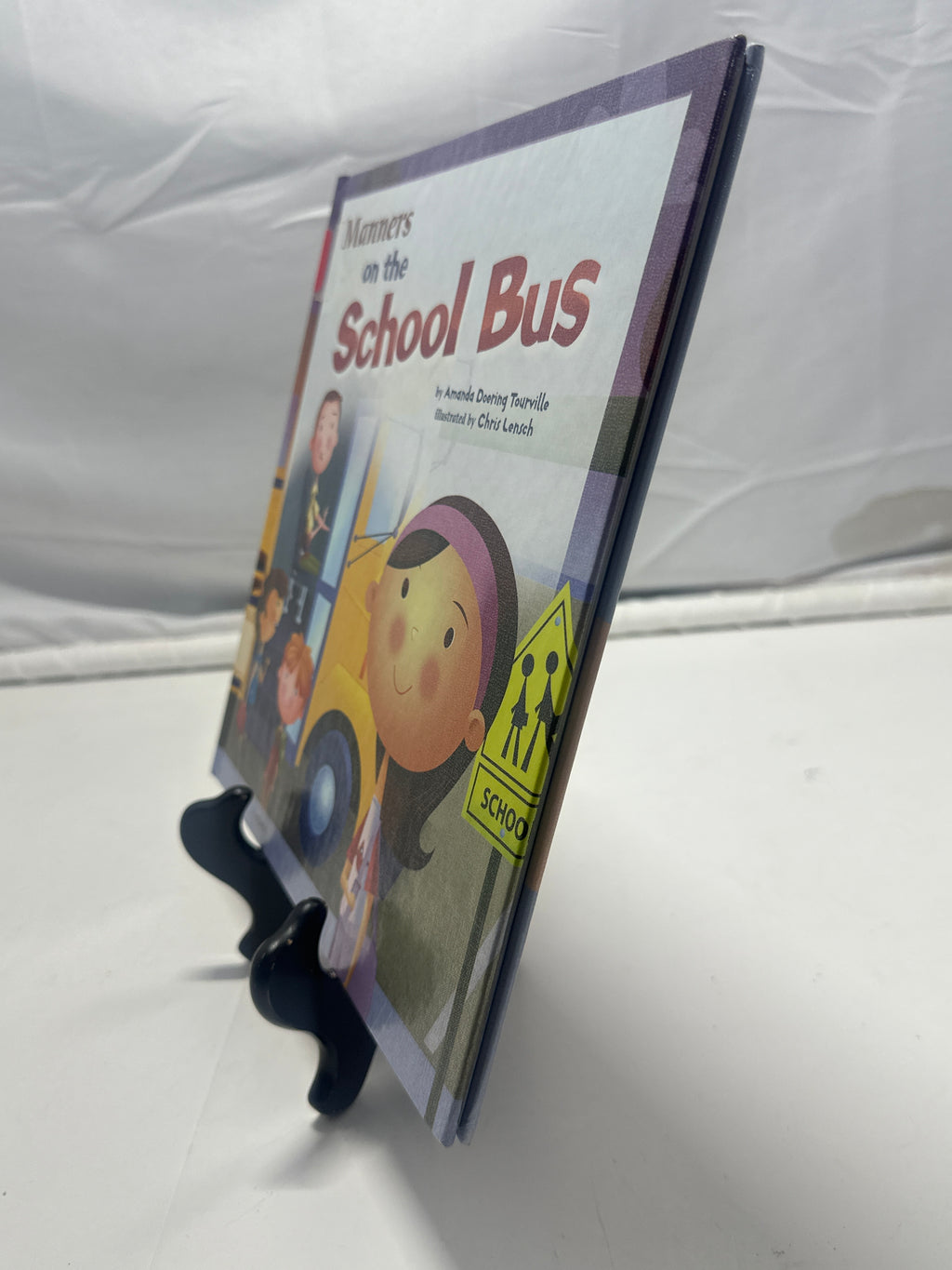 Manners on the school bus by Amanda Doering Tourville Hardcover Children's Book