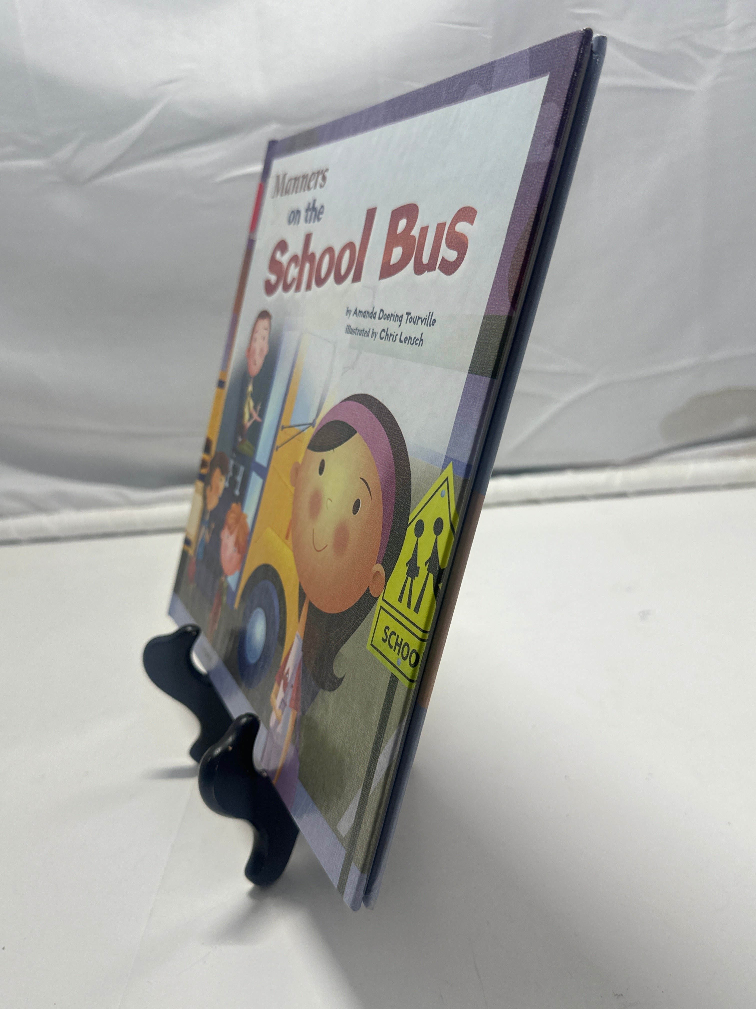Manners on the school bus by Amanda Doering Tourville Hardcover Children's Book
