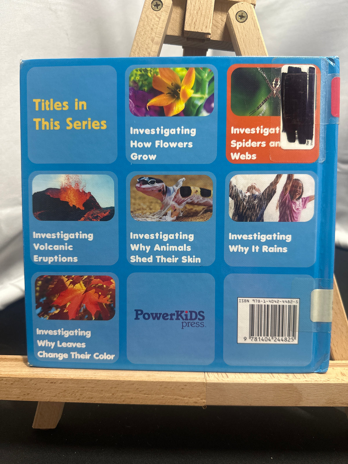Investigating spiders and their webs by Ellen René Hardcover Children's Book