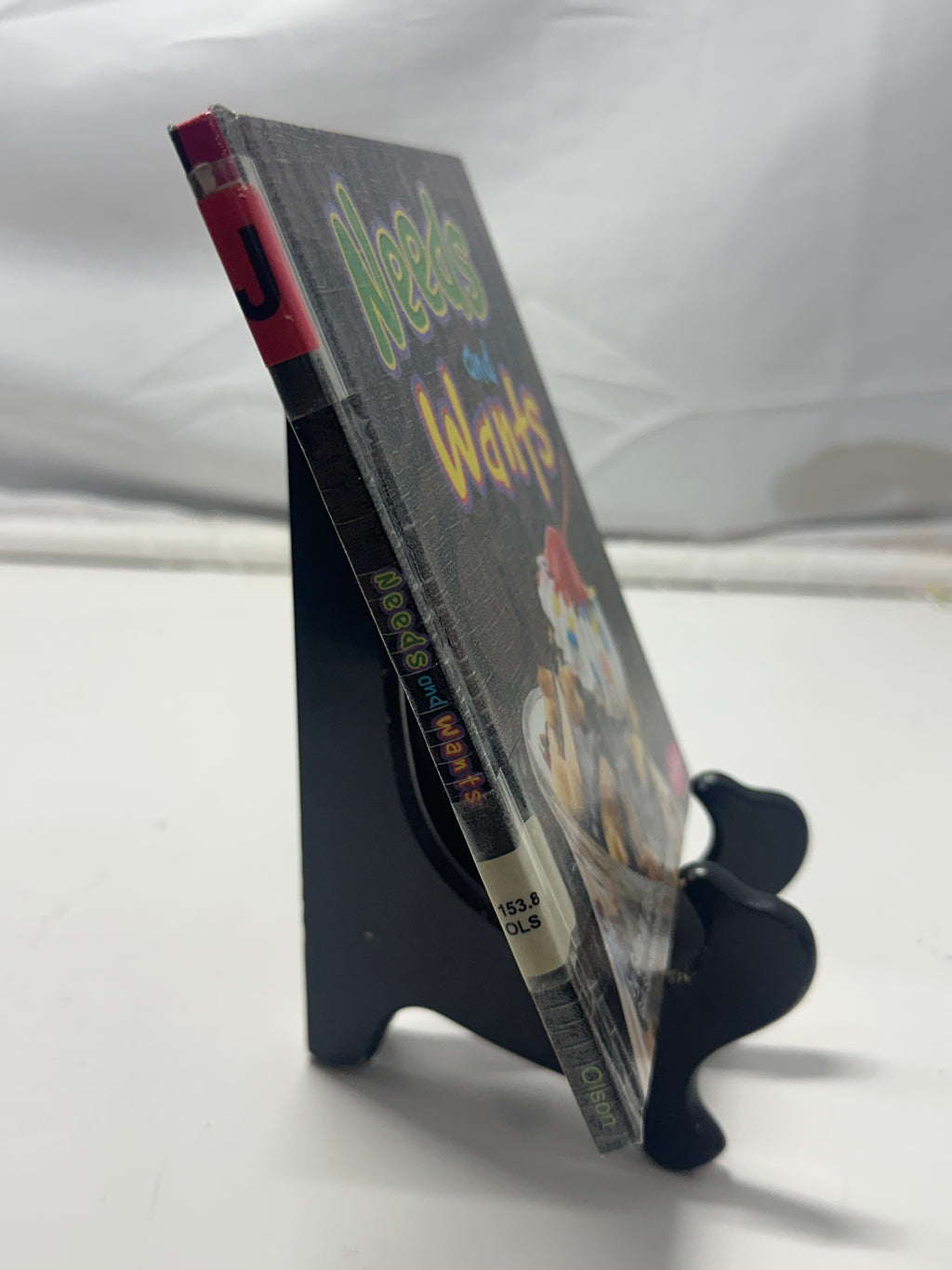 Needs and wants by Gillia M. Olson Hardcover Children's Book