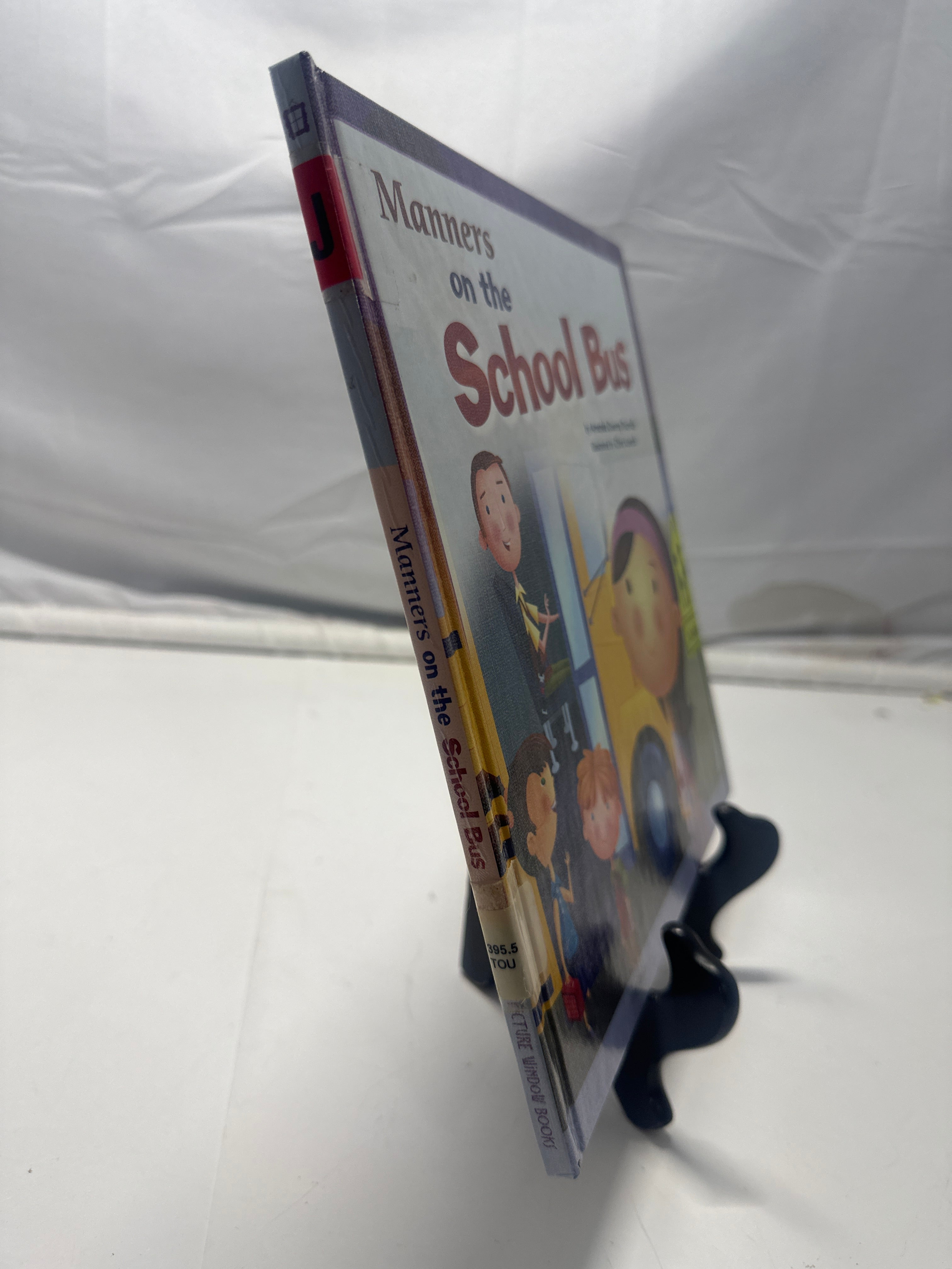 Manners on the school bus by Amanda Doering Tourville Hardcover Children's Book