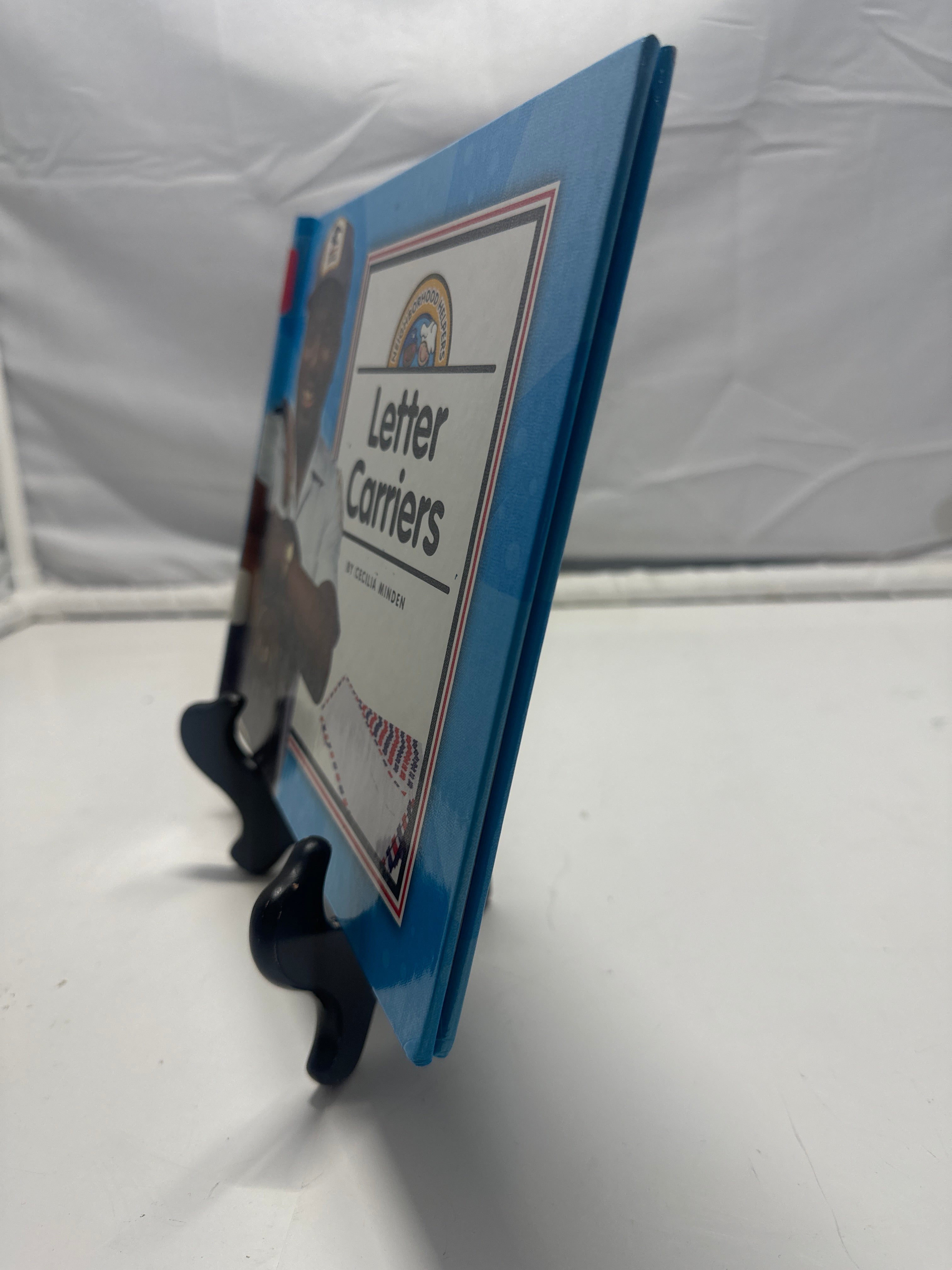 Letter carriers by Cecilia Minden Hardcover Children's Book