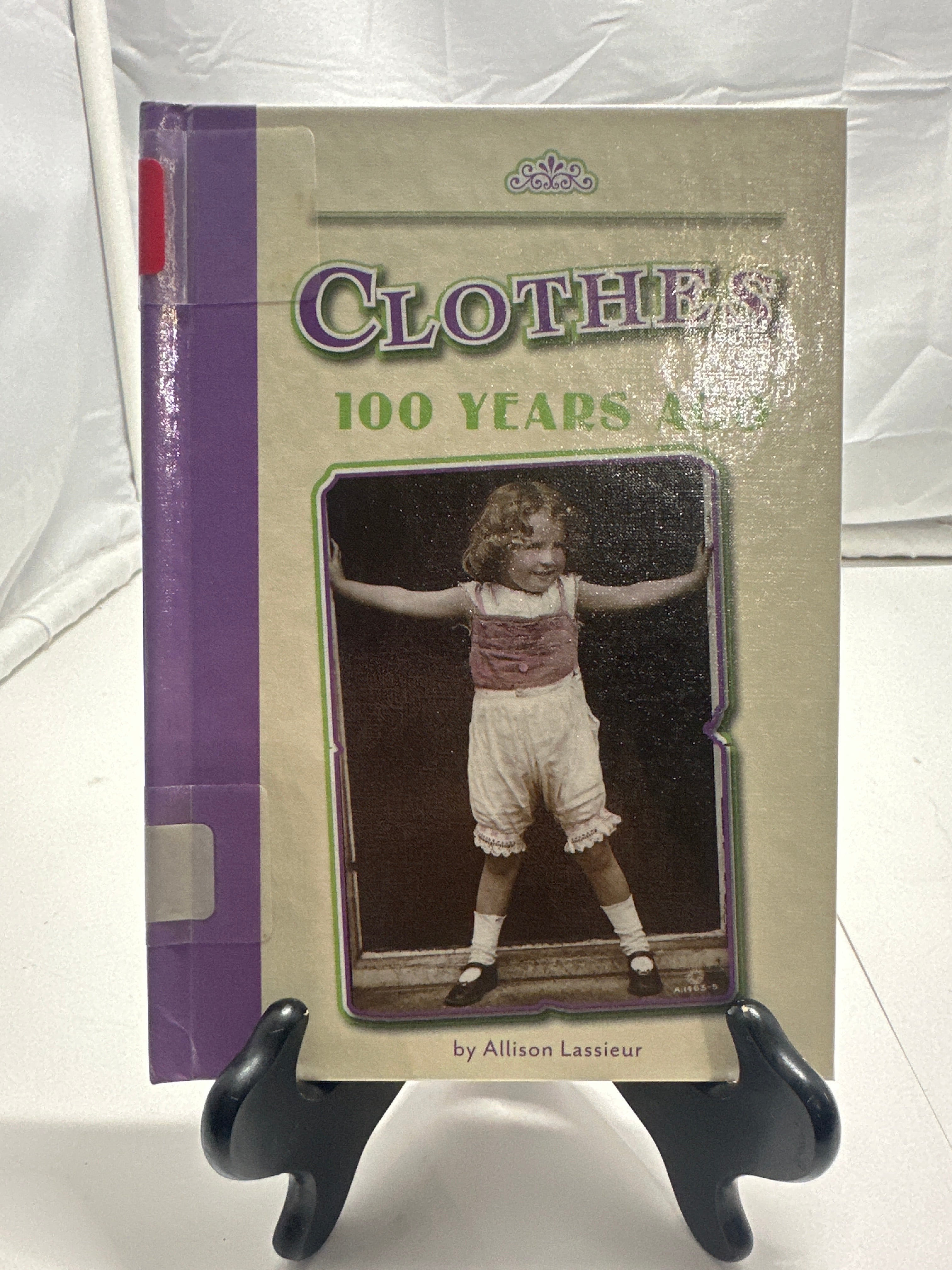 Clothes 100 years ago by Allison Lassieur Hardcover Children